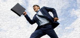 Man jumping with briefcase